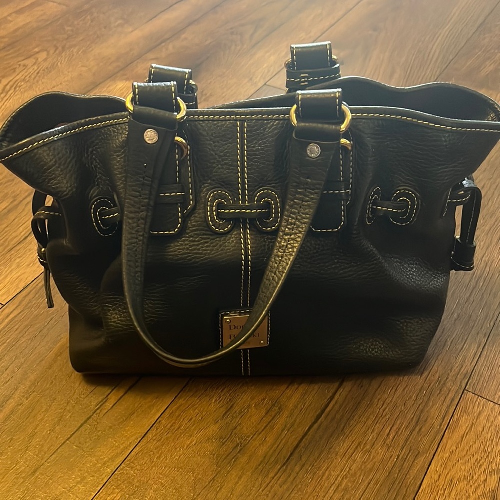 Dooney & Bourke black leather handbag with pink interior
